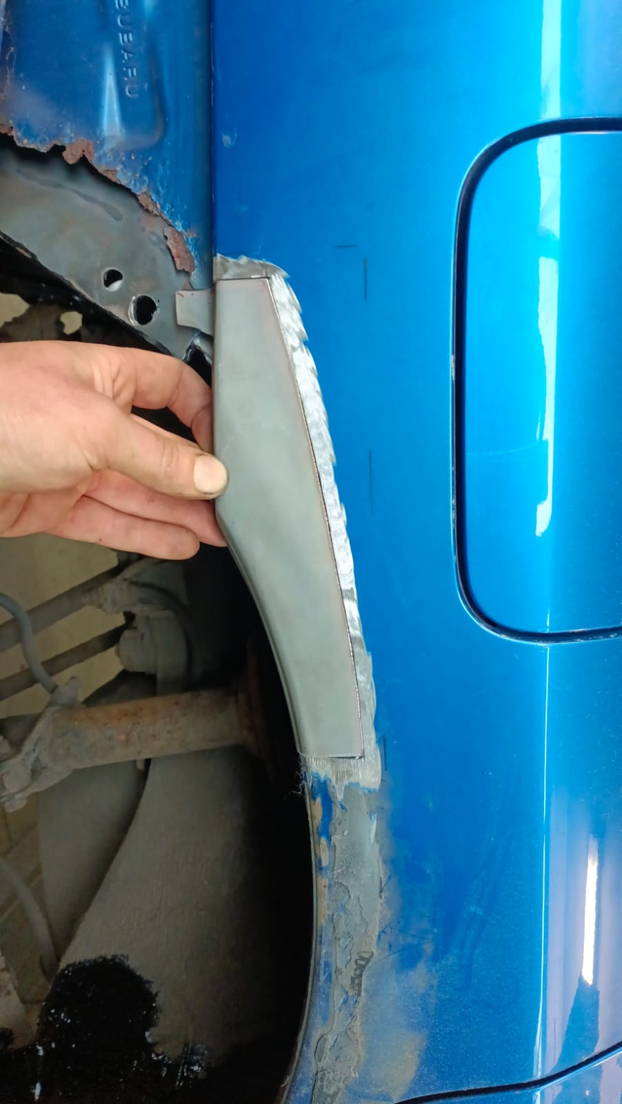 New metal plug-welded into arch